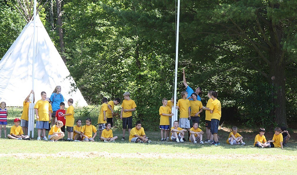 Group of kids otside near flagpole